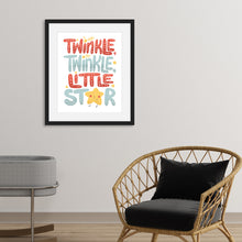 Load image into Gallery viewer, Artwork featured on a wall in a black frame with a rocker and a baby bassinet in the room. The artwork is on white paper and features hand drawn lettering reading &quot;Twinkle Twinkle Little Star&quot; The word star features a &quot;star&quot; for the A. 