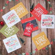Load image into Gallery viewer, A family Advent calendar pictured with Bible verses on one side of the square card and family activities on the other side. 