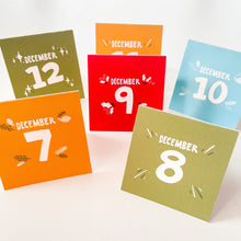Load image into Gallery viewer, A close up of the family Advent calendar cards sitting on a white table.