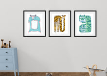 Load image into Gallery viewer, Three black frames with animal illustrations featured on a wall in a nursery. The first frame is a blue bear, the second frame is a yellow giraffe, and the last frame is a light green tiger. There&#39;s a blue dresser with toys on a top.