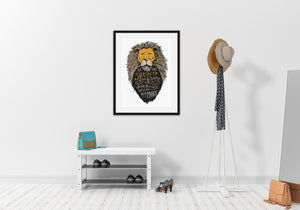 A black frame on a wall above a shoe rack and next to a coat rack. The print features an illustrated lion head with the quote "At The Sound of Your Roar, Sorrows Will Be No More."