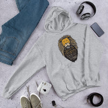 Load image into Gallery viewer, A light grey hoodie laying on the ground with objects around it. The hoodie features hand drawn illustration of the Chronicles of Narnia lion character Aslan. Inside the illustration there is the quote “At The Sound of Your Roar, Sorrows Will Be No More.”