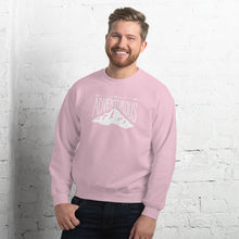 Load image into Gallery viewer, A man wearing a light pink hoodie with lettering and illustration in white with the phrase “Be Adventurous” with arrows pointing to the word “be” and a mountain illustration underneath the word “adventure.”