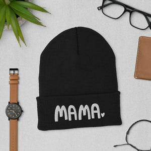 A black beanie winter hat featuring the word Mama with a small heart at the end of the word. The cozy hat makes a fun mother’s day gift. 