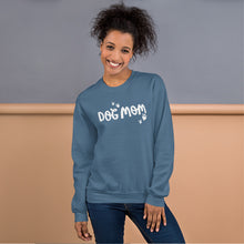 Load image into Gallery viewer, A indigo blue sweatshirt featuring the phrase Dog Mom in white lettering with white heart shaped paws around the words. 
