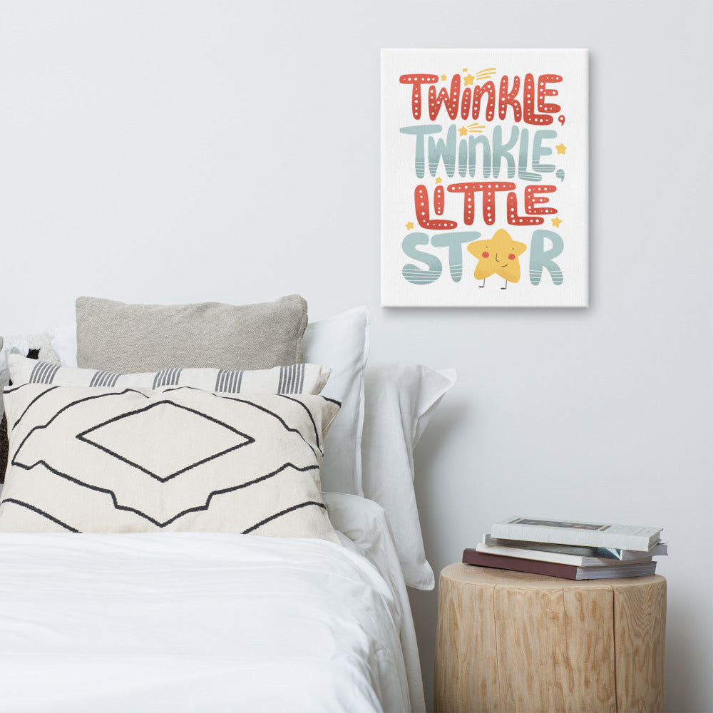 A canvas hanging above a bed. The cavnas is white and features hand drawn lettering reading 
