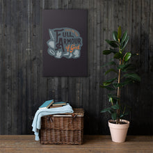 Load image into Gallery viewer, A dark gray canvas hangs on a dark wooden-clad wall, over a wicker basket holding books and blankets and a large potted plant. The canvas features the quote &#39;Put on the full armour of God&#39; in black and orange typography, with medieval-style pieces of armour illustrated in pale gray.