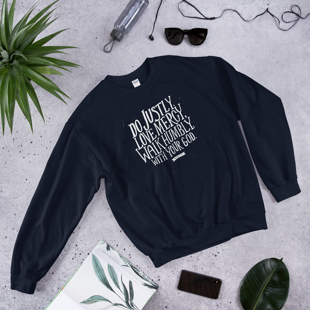 A Bible verse sweatshirt in navy with white lettering in the words Do justly, love mercy, walk humbly, with your God, Micah 6:8.