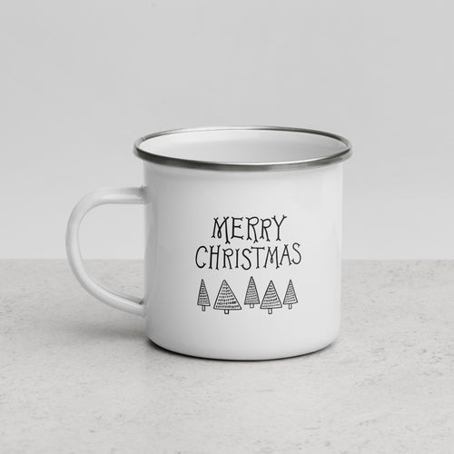 White enamel mug featured on a white table top and white background. The design features illustrated words and modern illustrated trees below the words. The words read 
