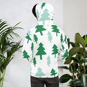 A man wearing a white hoodie showing how the back of the hoodie look and the back of the hoodie. The hoodie features a pattern of illustrated pines trees in dark and light green on the white hoodie. 