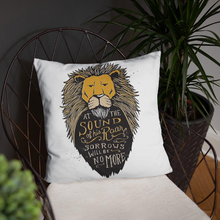 Load image into Gallery viewer, A white square pillow featured on a black wire chair with plants in the background. The pillow artwork features hand drawn illustration of the Chronicles of Narnia lion character Aslan. Inside the illustration there is the quote “At The Sound of Your Roar, Sorrows Will Be No More.”