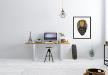 Load image into Gallery viewer, A black frame hanging on an office wall to the side of a desk. The artwork features an illustrated Aslan (the lion from Chronicles of Narnia). Inside the lion the Narnia quote is featured reading “At The Sound of Your Roar, Sorrows Will Be No More.”