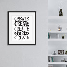 Load image into Gallery viewer, Artwork featured in a black frame on a wall featured with shelves in the background. The artwork is on a white paper with black lettering in the word “create” written five times. 