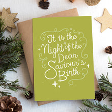 Load image into Gallery viewer, A photo of a Christmas card on top of a brown paper wrapped gift with Christmas decor around it.  The background of the card is a lime green with the word &quot;it is the night of the dear saviour&#39;s birth&quot; in script white lettering. 
