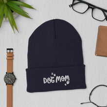 Load image into Gallery viewer, A navy beanie hat with the words Dog Mom on the hat’s cuff. There are small hearts in the shapes of paws around the words.