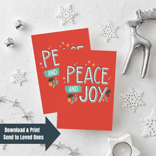 Load image into Gallery viewer, Two Christmas cards laying on a white background with white and silver Christmas decorations on the table. The card has a red background with the words &quot;peace and joy&quot; in white and illustrations of stars and holly leaves around the wording. The words &quot;download &amp; print, send to loved ones&quot; are on top of the image in the bottom lefthand corner.