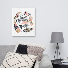 Load image into Gallery viewer, A canvas shown on a wall above a sofa. The canvas has a white background with the words &quot;Tender Warriors Are Being Made Here&quot; The words are in pink, navy and dark mustard yellow. 