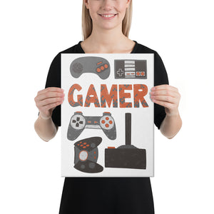 A woman holding a canvas in her hands with hand drawn lettering and illustrations featuring different game controllers and the word "gamer." The illustrations and gamer word are in red, grey and black.  