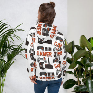 A woman wearing a white hoodie showing how the back of the hoodie look and the back of the hoodie. The hoodie features different game controllers and the word "gamer" in a repeat pattern throughout the hoodie. The illustrations and gamer word are in red, grey and black. 