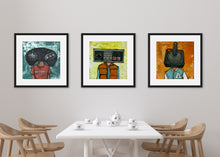 Load image into Gallery viewer, Three black frames on a wall above a kitchen table. Three black frames featuring a vintage Nintendo controller, the second frame a Sega Genesis original controller, and the third frame is an Atari frame. 