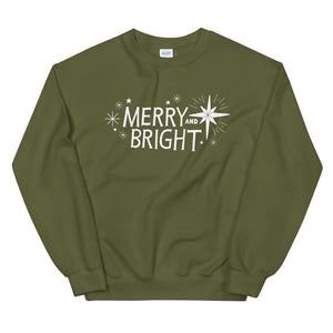 A hunter green sweatshirt on a white background. The sweatshirt features the words Merry and Bright with illustrated Christmas stars around it. The words and star illustrations are in white.