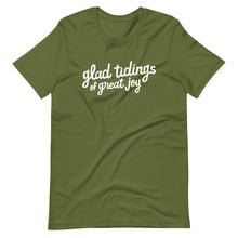 Load image into Gallery viewer, An olive green T-shirt on a white background. The navy shirt features words in white reading &quot;glad tidings of great joy&quot; in white. 