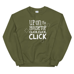 An olive green sweatshirt on a white background. The sweatshirt has the words "Up on the housetop, click, click, click" in white. There are three white stars around the letters. 