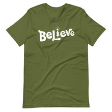 Load image into Gallery viewer, An olive green T-shirt on a white background. The red shirt features the hand lettered word &quot;Believe&quot; in white with the &quot;I&quot; featured as an illustrated Christmas tree. 