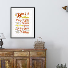 Load image into Gallery viewer, A black frame featuring letter artwork reading &quot;Once a king or queen of Narnia, always a king or queen of Narnia.&quot; . The frame is above a dresser with a basket and lamp on the dresser. 