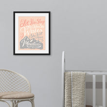 Load image into Gallery viewer, A pink print hanging on a pale grey wall, next to a white cot. The print reads &#39;Let her sleep for when she wakes she will move mountains&#39; in a pink, white, and light grey lettering design, with a grey mountain illustration at the bottom.