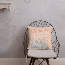 Load image into Gallery viewer, A pink cushion sits on a metal chair against a pale plaster wall. The cushion reads &#39;Let her sleep for when she wakes she will move mountains&#39; in a pink, white, and light grey lettering design, with a grey mountain illustration at the bottom.