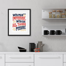 Load image into Gallery viewer, Artwork featured on a kitchen wall with a black frame. The artwork is on white paper with hand drawn lettering with the Matthew 19:26 Bible verse reading &quot;With man this is impossible but with God all things are possible.&quot;  The lettering is in navy, red and mustard yellow. 