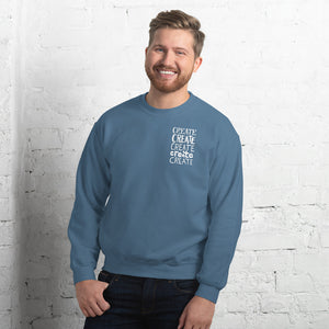 A man wearing an indigo blue sweatshirt with the word "create, create, create, create, create" in white in a small rectangle on the upper left side.