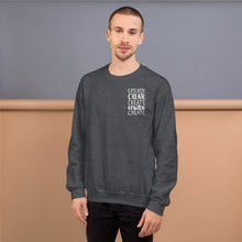 Load image into Gallery viewer, A man wearing a dark grey sweatshirt with the word &quot;create, create, create, create, create&quot; in white in a small rectangle on the upper left side.