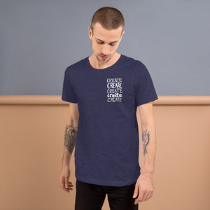 A man wearing a navy short sleeved t-shirt. The tee features the lettering and illustration in white. The phrase "create, create, create, create, create" is in a small rectangle on the upper left side. 