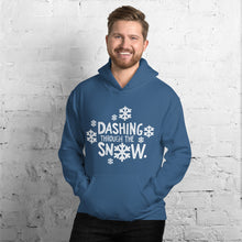 Load image into Gallery viewer, A man wearing a blue hoodie featuring hand drawn lettering in white reading Dashing through the snow. There are white snowflakes around the words. 