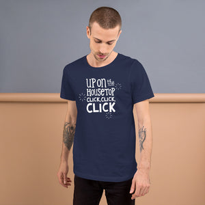 A man wearing a navy short sleeved t-shirt. The tee features lettering of the words "Up on the housetop, click, click, click." The words are in white with three stars in white surrounding the words. 