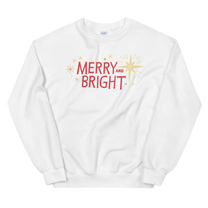 A white sweatshirt on a white background. The sweatshirt features the words Merry and Bright with illustrated Christmas stars around it. The words are in red and star illustrations are in yellow.