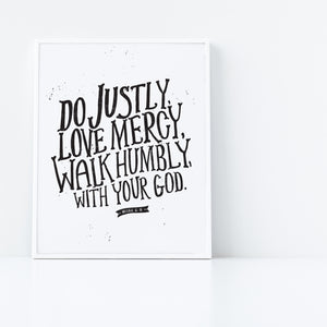 Artwork in a white frame with the artwork printed on white paper and black lettering featuring the Bible verse “Do justly, love mercy, walk humbly, with your God, Micah 6:8.”