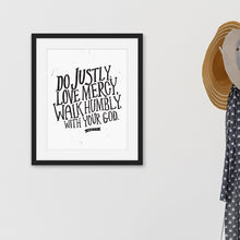 Load image into Gallery viewer, Black framed artwork featuring a white paper print with black lettering featuring the Bible verse “Do justly, love mercy, walk humbly, with your God, Micah 6:8.”