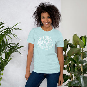 A ice blue tee with lettering featuring the words Do justly, love mercy, walk humbly, with your God, Micah 6:8. 
