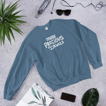 Load image into Gallery viewer, This sweatshirt is indigo blue with white lettering with the words More Precious Than Jewels and a small illustrated jewel in the bottom corner of the words. Inspired by Proverbs 3:15-18, this comfy sweatshirt makes a lovely christian Mother’s Day gift. 