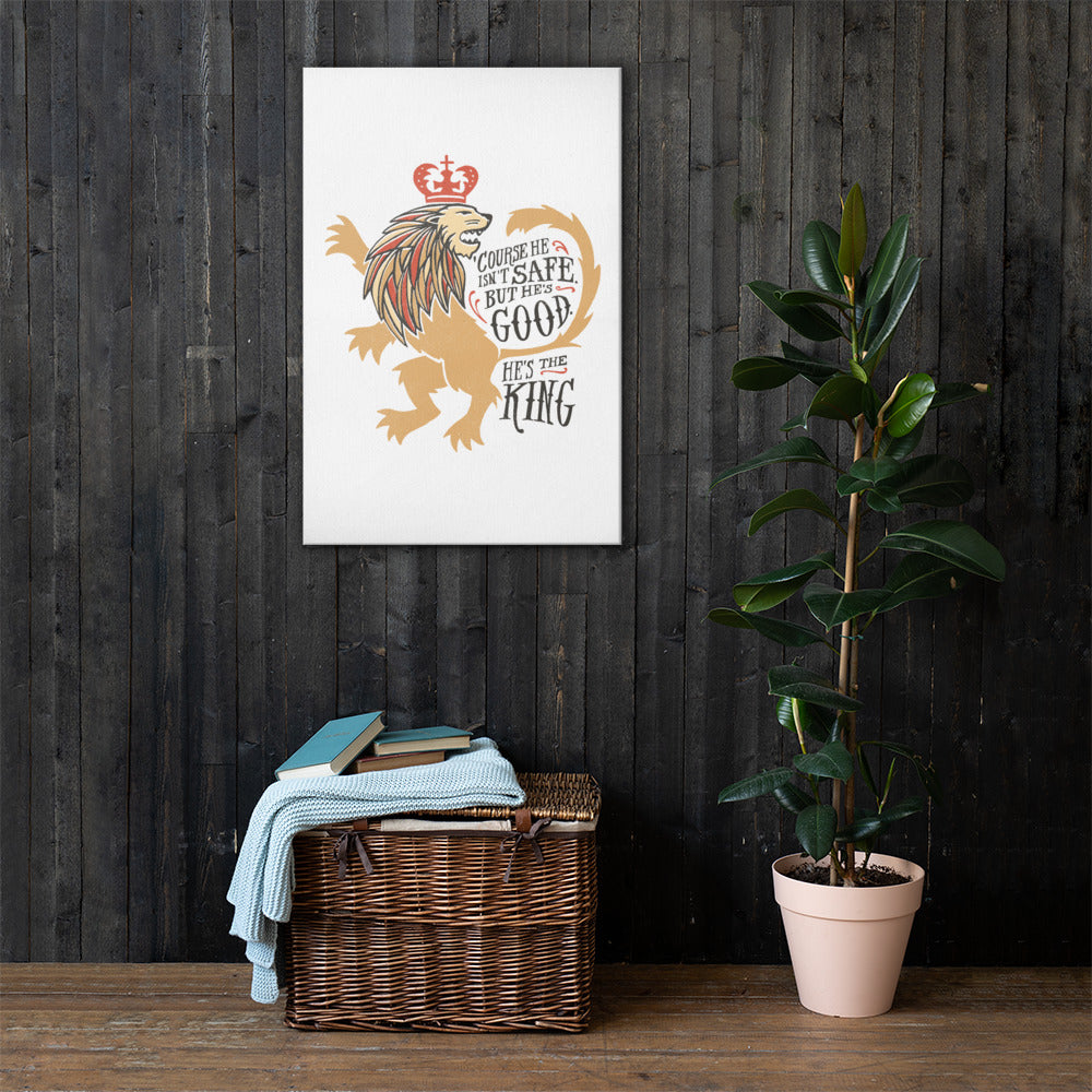 A white canvas hanging on a wood panel wall with a basket and plant below it. The artwork features hand drawn illustration of the Chronicles of Narnia lion character Aslan. Inside the illustration there is the quote 