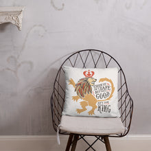 Load image into Gallery viewer, A white square pillow with artwork on it on a wire shirt. The artwork features hand drawn illustration of the Chronicles of Narnia lion character Aslan. Inside the illustration there is the quote &quot;Course He Isn&#39;t Safe, But He&#39;s Good. He&#39;s the King.&quot;