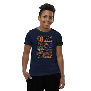 A boy wearing a navy short sleeved T-Shirt. The artwork features hand drawn lettering of the Narnia quote "Once a king or queen of Narnia, always a king or queen of Narnia."