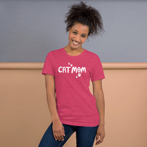 A raspberry pink tee with the words Cat Mom in white and white heart shaped hearts around the words. 