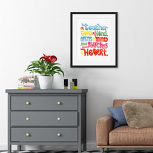 Load image into Gallery viewer, Artwork in a black frame featured in a room with the words “A teacher takes a hand, opens a mind, and touches a heart.” The “a” in the word “heart” is a heart shape and the words are blue, red, yellow and green. 