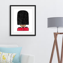Load image into Gallery viewer, A black frame above a white sofa with some pillows and a lamp to the side. The frame has an illustration of a a queen&#39;s guard.