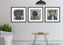 Load image into Gallery viewer, Three black frames featured in a living room. The frames include three different prints of vintage radios. 