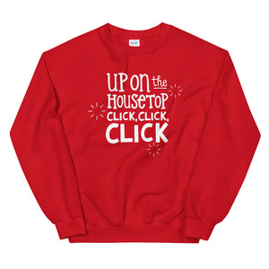 A red sweatshirt on a white background. The sweatshirt has the words "Up on the housetop, click, click, click" in white. There are three white stars around the letters. 